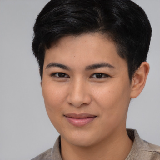 Joyful asian young-adult female with short  brown hair and brown eyes