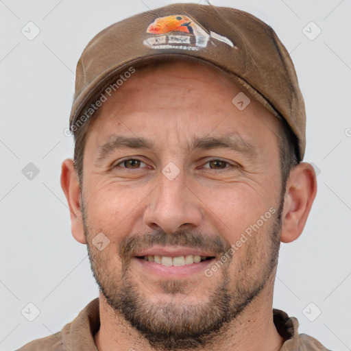 Joyful white adult male with short  brown hair and brown eyes