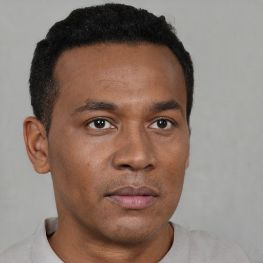 Neutral black young-adult male with short  black hair and brown eyes