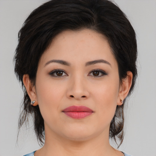 Joyful asian young-adult female with medium  brown hair and brown eyes