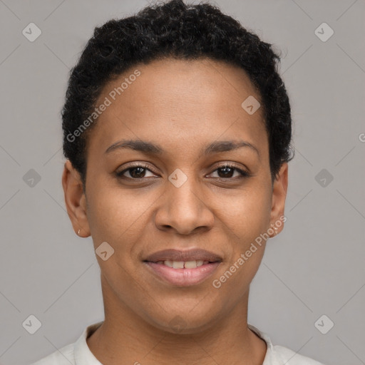 Joyful black young-adult female with short  black hair and brown eyes