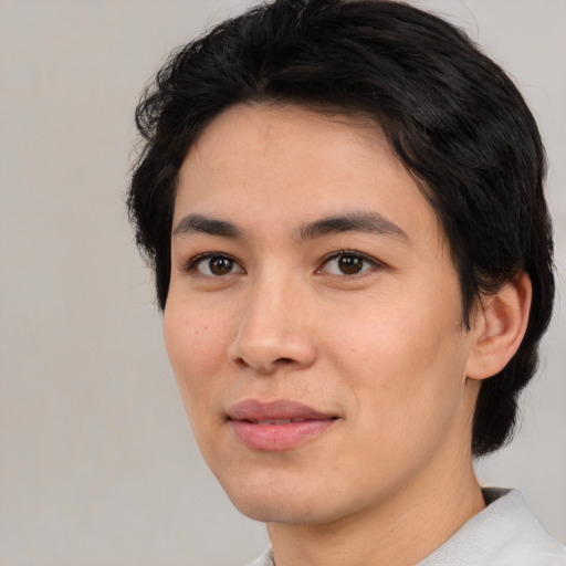 Joyful asian young-adult female with medium  black hair and brown eyes