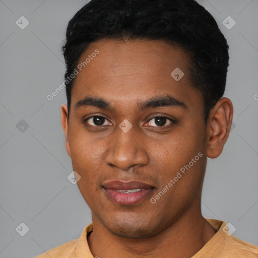 Joyful black young-adult male with short  black hair and brown eyes