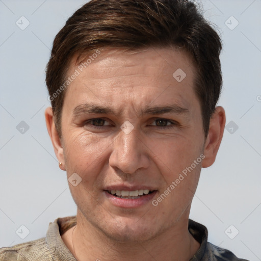 Joyful white adult male with short  brown hair and grey eyes