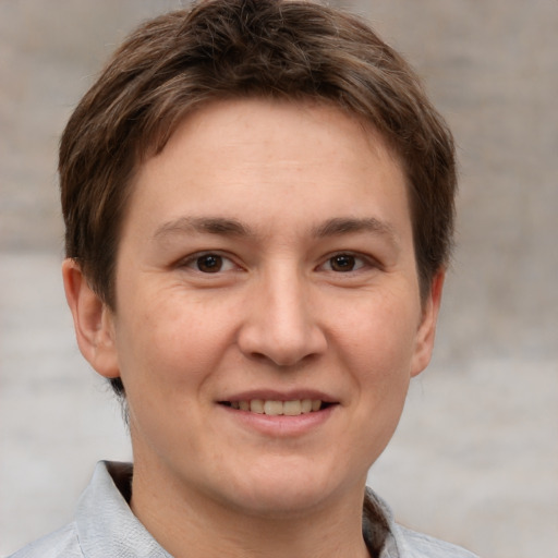 Joyful white young-adult female with short  brown hair and grey eyes