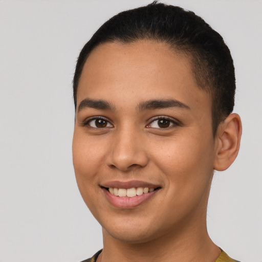 Joyful latino young-adult female with short  brown hair and brown eyes