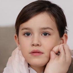 Neutral white child female with short  brown hair and brown eyes