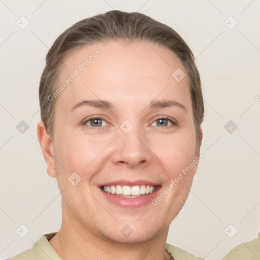 Joyful white young-adult female with short  brown hair and grey eyes