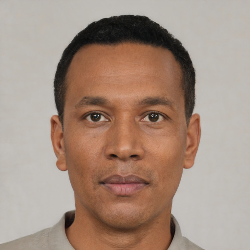 Neutral black adult male with short  black hair and brown eyes