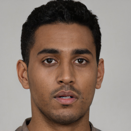 Neutral latino young-adult male with short  black hair and brown eyes