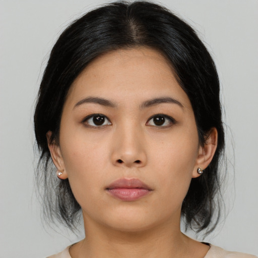 Neutral asian young-adult female with medium  black hair and brown eyes