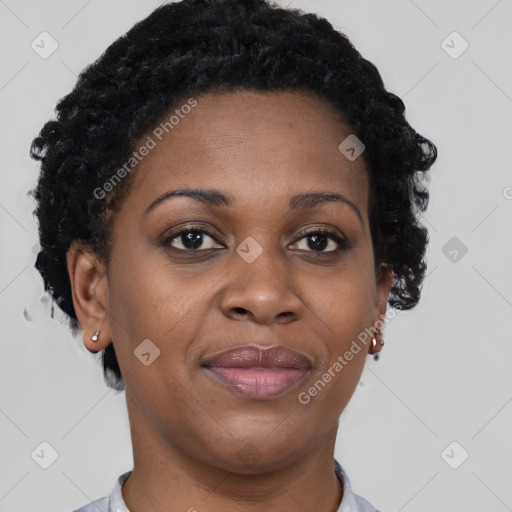 Joyful black adult female with short  brown hair and brown eyes