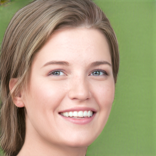 Joyful white young-adult female with long  brown hair and green eyes