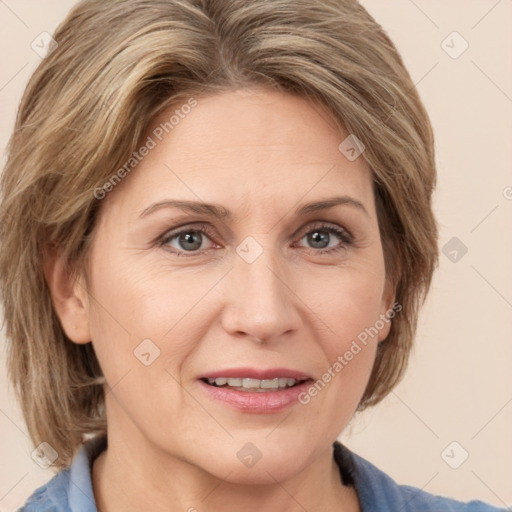 Joyful white adult female with medium  brown hair and grey eyes