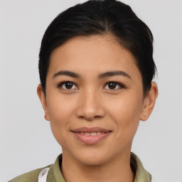 Joyful asian young-adult female with short  brown hair and brown eyes