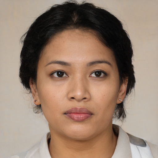 Neutral latino young-adult female with medium  brown hair and brown eyes