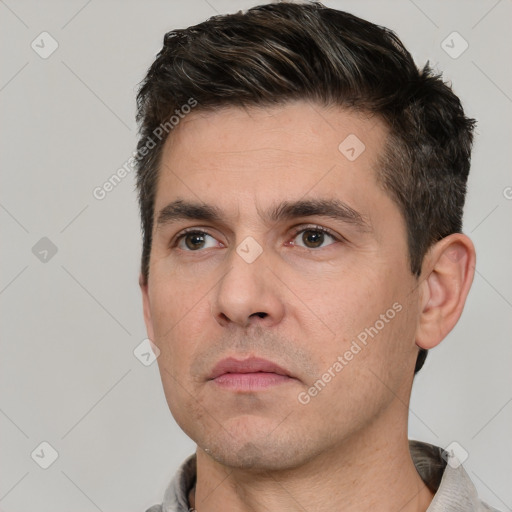 Neutral white adult male with short  black hair and brown eyes