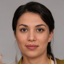 Joyful white young-adult female with medium  brown hair and brown eyes