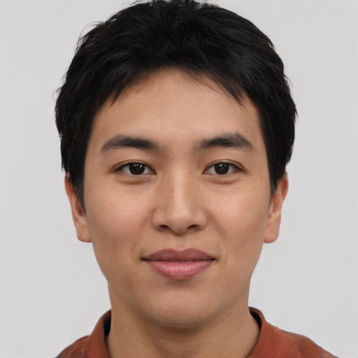 Joyful asian young-adult male with short  black hair and brown eyes