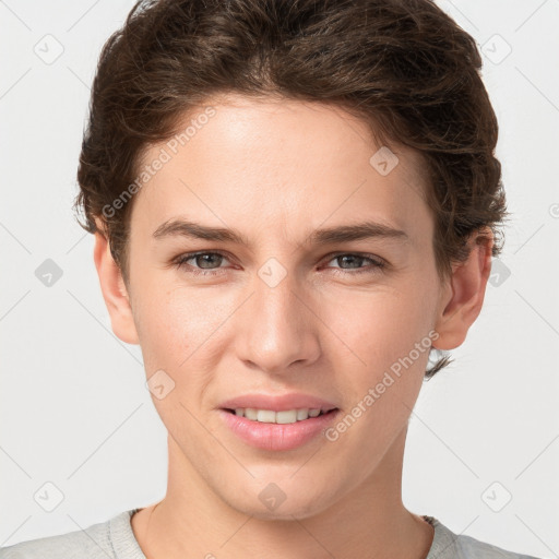 Joyful white young-adult female with short  brown hair and grey eyes