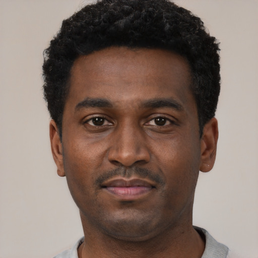 Neutral black young-adult male with short  black hair and brown eyes