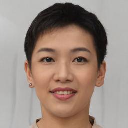 Joyful asian young-adult female with short  brown hair and brown eyes