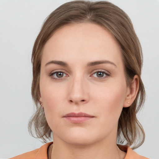 Neutral white young-adult female with medium  brown hair and grey eyes