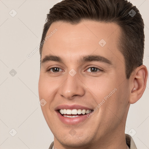 Joyful white young-adult male with short  brown hair and brown eyes