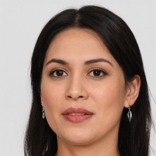 Joyful latino young-adult female with long  black hair and brown eyes