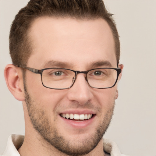 Joyful white adult male with short  brown hair and grey eyes