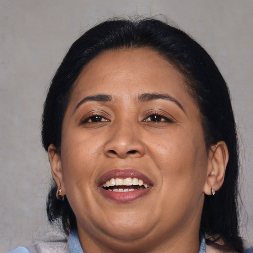 Joyful asian adult female with medium  brown hair and brown eyes