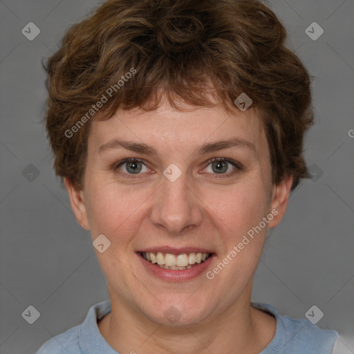 Joyful white adult female with short  brown hair and grey eyes