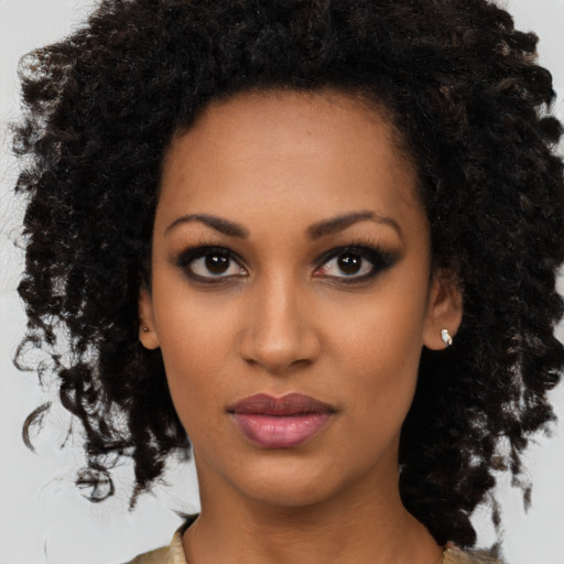 Neutral black young-adult female with medium  brown hair and brown eyes