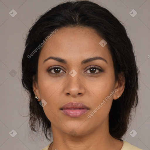 Joyful latino young-adult female with medium  brown hair and brown eyes