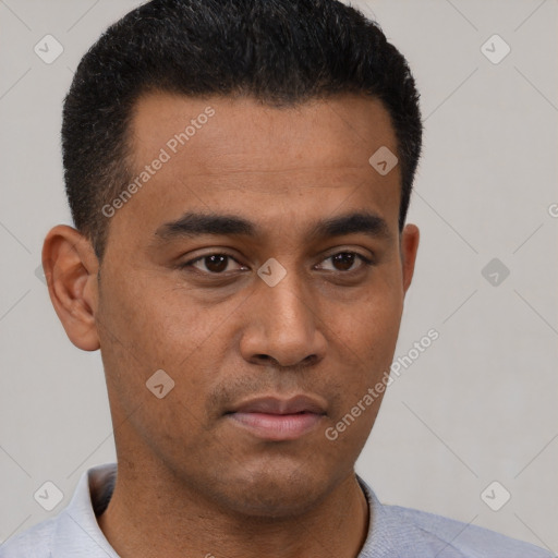 Neutral latino young-adult male with short  brown hair and brown eyes