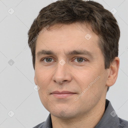 Joyful white adult male with short  brown hair and brown eyes