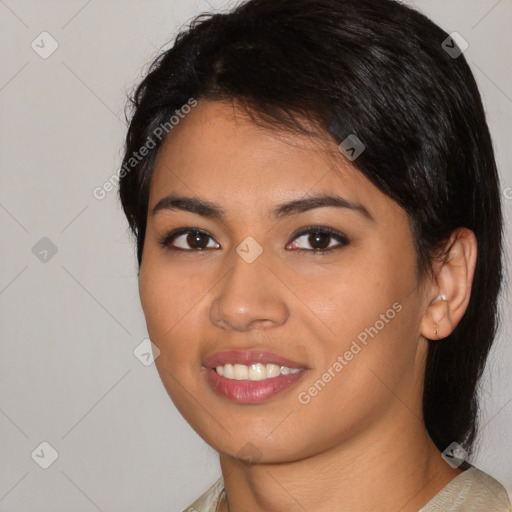 Joyful asian young-adult female with medium  black hair and brown eyes