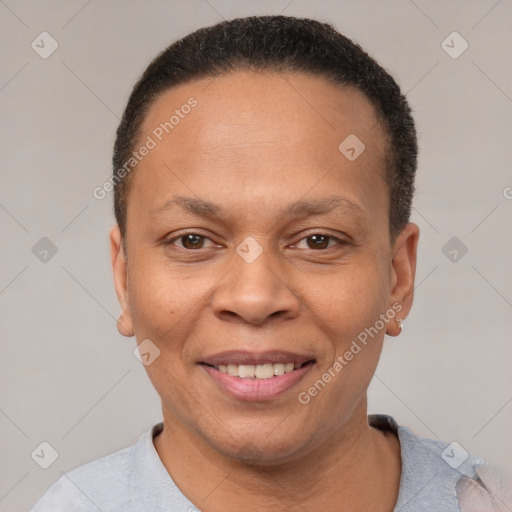 Joyful black adult female with short  brown hair and brown eyes