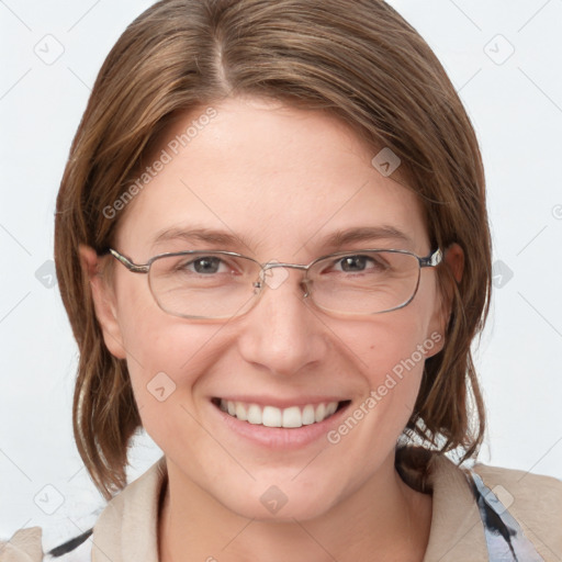 Joyful white adult female with medium  brown hair and blue eyes