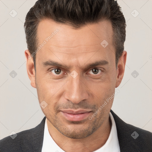 Joyful white adult male with short  brown hair and brown eyes