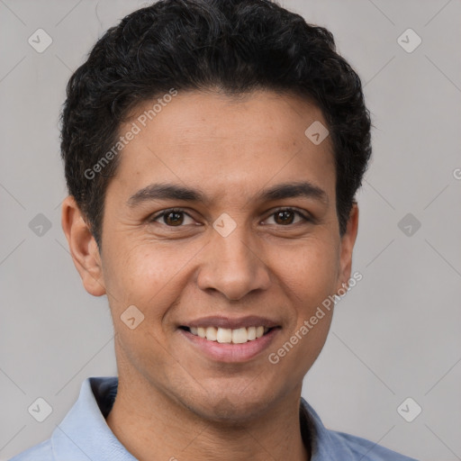 Joyful white young-adult male with short  black hair and brown eyes