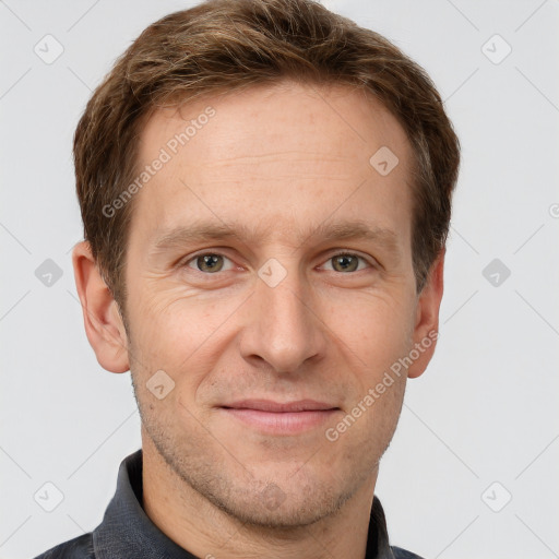 Joyful white adult male with short  brown hair and grey eyes