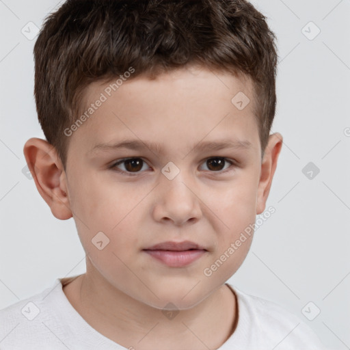 Joyful white child male with short  brown hair and brown eyes