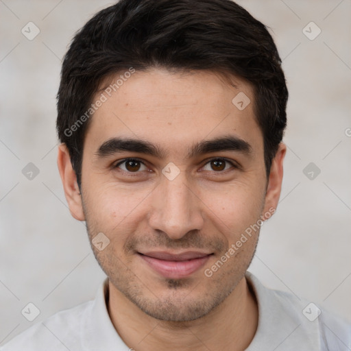 Joyful white young-adult male with short  black hair and brown eyes