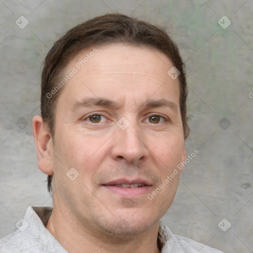 Joyful white adult male with short  brown hair and grey eyes