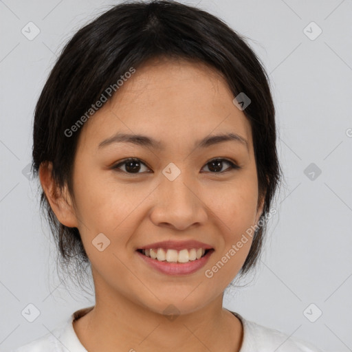 Joyful asian young-adult female with medium  brown hair and brown eyes