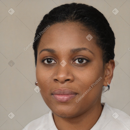 Joyful black young-adult female with short  black hair and brown eyes