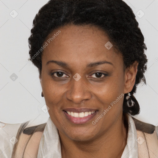 Joyful black adult female with short  brown hair and brown eyes