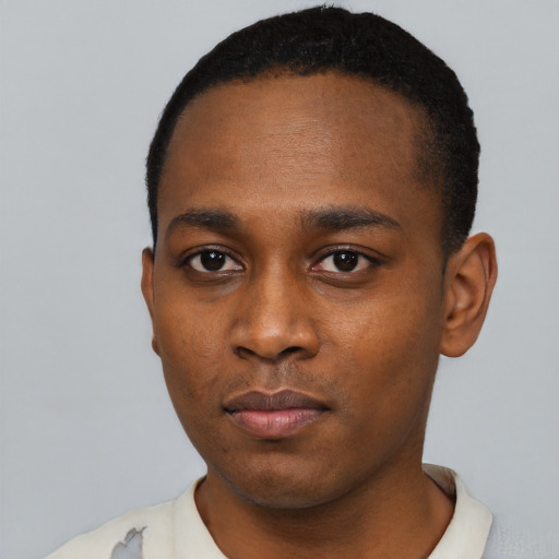 Neutral black young-adult male with short  black hair and brown eyes