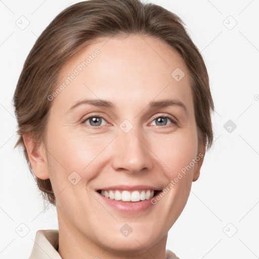 Joyful white young-adult female with short  brown hair and grey eyes